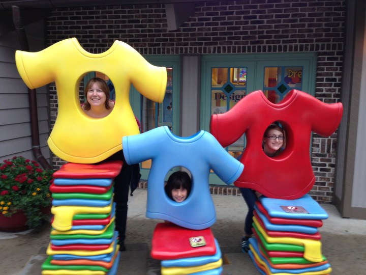 My girls posing for a cute pic in front of the Design-A-Tee store