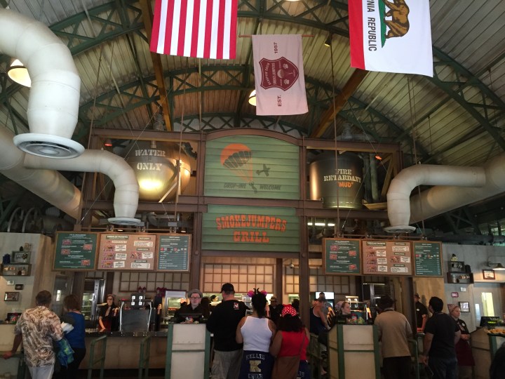Formerly Taste Pilots Grill, the new building retains the high-ceiling look with a more national park theme