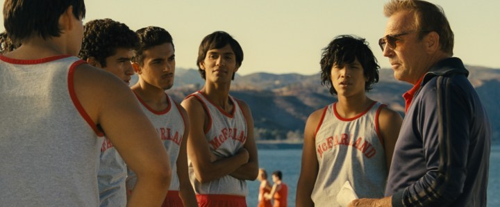 McFARLAND, USA..L to R: Johnny Sameniego (Hector Duran), Victor Puentes (Sergio Avelar), Damacio Diaz (Jamie Michael Aguero), Jose Cardenas (Johnny Ortiz) and Coach Jim White (Kevin Costner)..Ph: Film Frame..Courtesy of Disney 2015