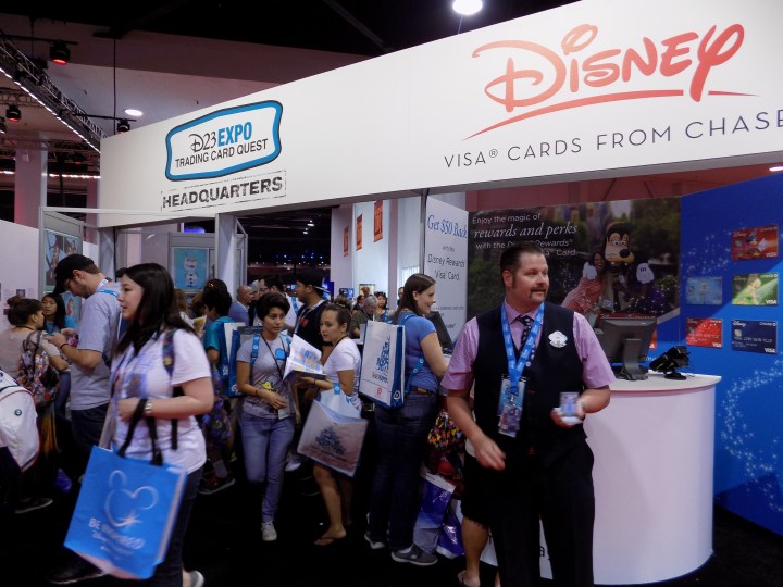 A crazy zoo of people collecting the Disney VISA trading cards
