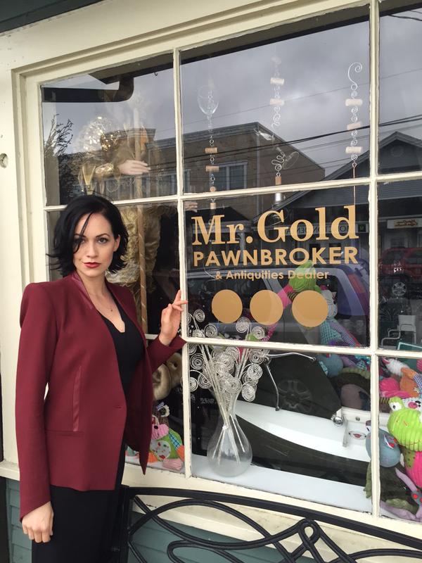 Reini in front of Mr. Gold's pawn shop in the real town of Steveston Village in British Columbia, Canada