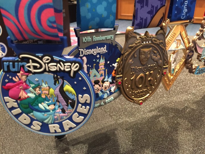 The different medals on display at the runDisney booth
