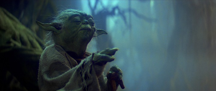 Yoda using the Force to lift Luke's X-wing out of the swamp