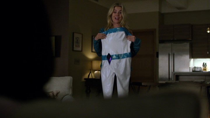 Patsy showing Jessica the costume she had for her superhero days. A real life replica of her Jewel outfit