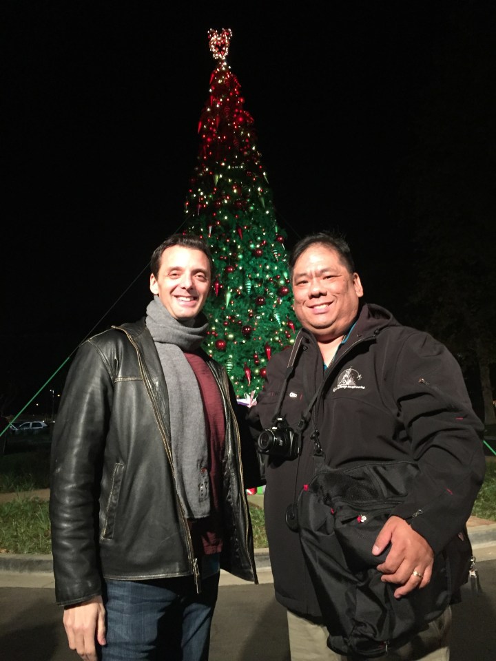 Standing in front of the Christmas tree with Jeffrey Epstein on the studio grounds