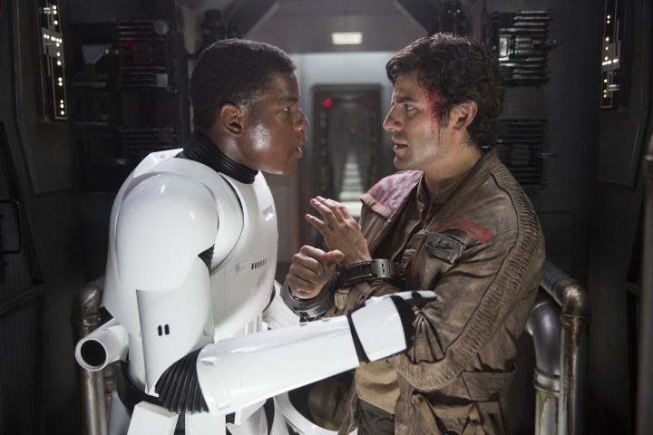 Star Wars: The Force Awakens..L to R: Finn (John Boyega) and Poe Dameron (Oscar Isaac) talk about escaping from the First Order Ph: David James..copyright 2015 Lucasfilm Ltd. TM. All Rights Reserved.