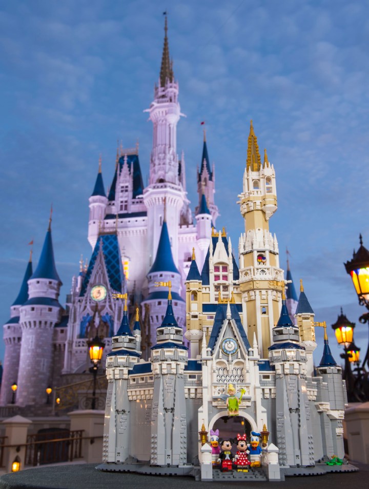 The LEGO Disney Castle set as photographed in front of the actual Walt Disney World Cinderella Castle on which it is based