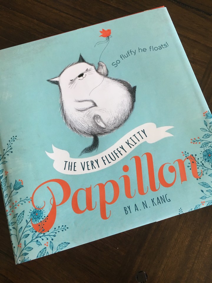 Simply designed cover, the blue instantly appeals to the eye and makes you feel comfort.  The kitty is just adorable