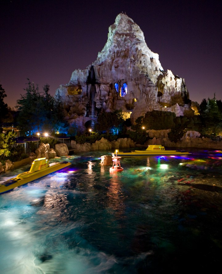 MATTERHORN BOBSLEDS AT NIGHT -- The first tubular steel roller coaster opened in 1959 at Disneyland adjacent to the Submarine Voyage Lagoon.  Guests on the Matterhorn Bobsleds scale the snowy summit in a racing toboggan and speed down the slopes to a sensational splashdown in an Apine pond, while the Abominable Snowman is rumored to be lurking around every turn.  (Paul Hiffmeyer/Disneyland)